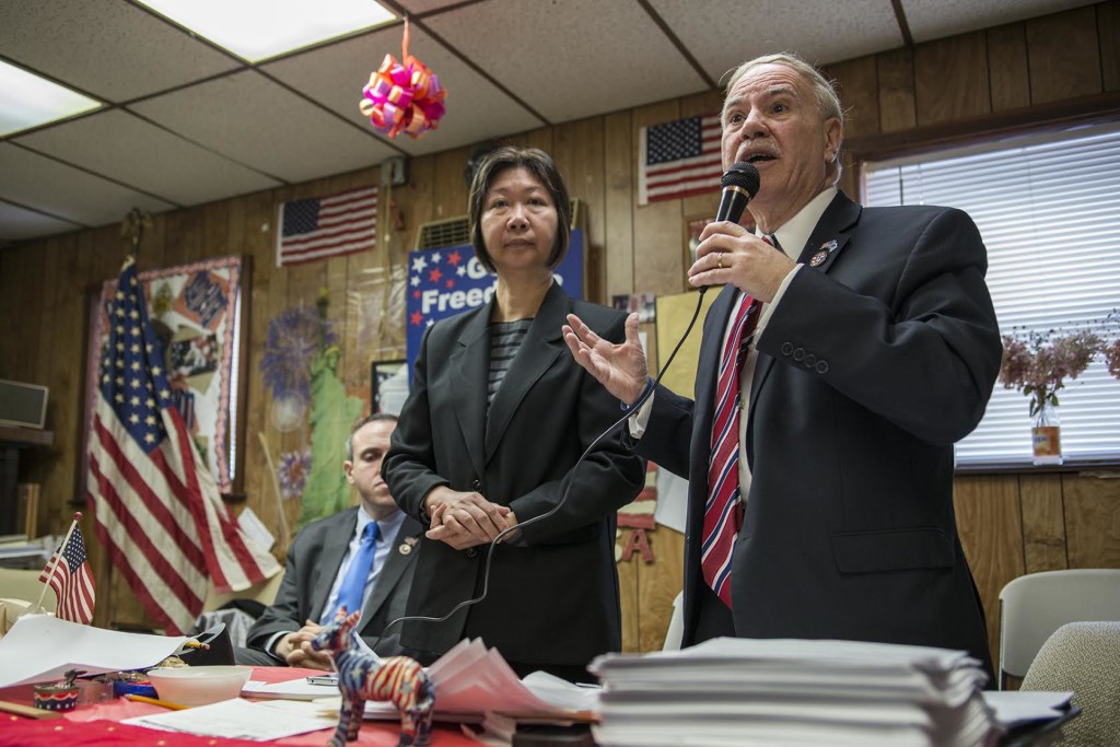 Assemblyman William Colton explains why he's interested in running for Congress as female district leader Nancy Ton and  City Councilman Mark Treyger look on. 