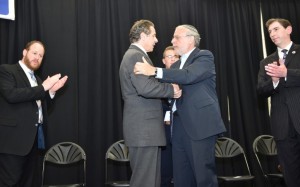 Gov. Andrew Cuomo & Assemblyman Dov Hikind shake hands as City Councilmembers David Greenfield and Chaim Deutsch look on.