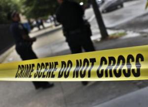 NYPD crime scene tape is seen at the site of a shooting at the corner of Marcus Garvey Blvd. and Pulaski Street in the Brooklyn borough of New York