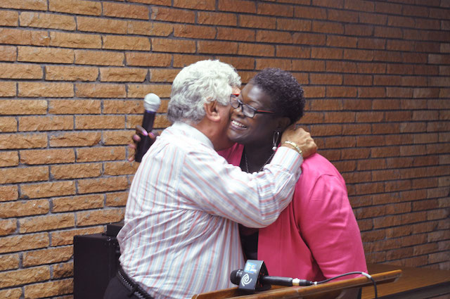 Frank Seddio gives Roxanne Persaud a hug of support.