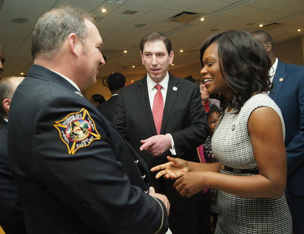 Assembly Member Rodneyse Bichotte and City Council Member Chaim Deutsch share a light moment with FDNY brass.