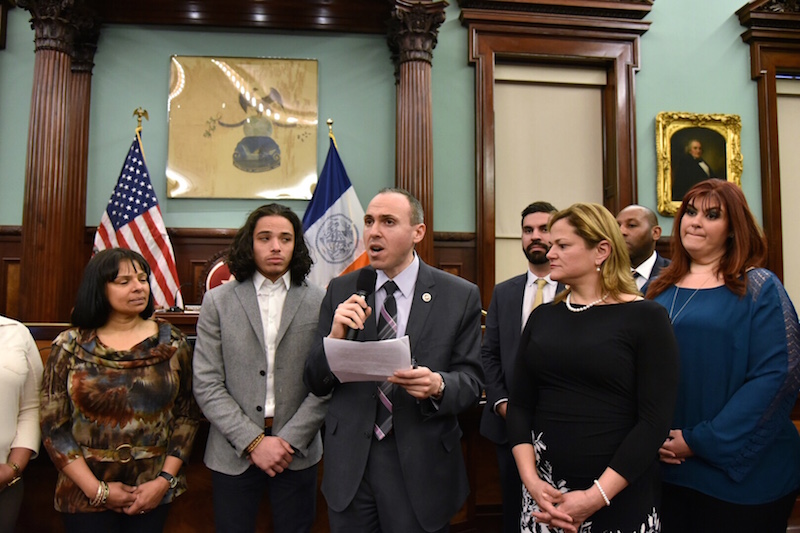 City Council Member Mark Treyger presents a City Council proclamation to 