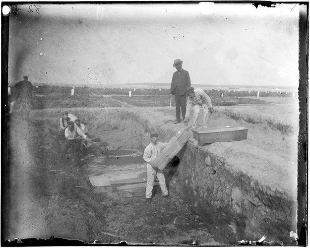 A_trench_at_the_potter’s_field_on_Hart_Island,_circa_1890_by_Jacob_Riis