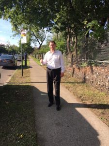City Councilman Chaim Deutsch stands along East 15th Street after the DOS cleared the area.