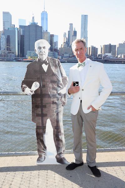 NEW YORK, NY - AUGUST 22: Bill Nye poses next to a stand-up of Thomas Edison during the National Park Foundation's #FindYourPark event, celebrating the National Park Service's centennial at Brooklyn Bridge Park on August 22, 2016 in New York City. (Photo by Neilson Barnard/Getty Images for National Park Service)