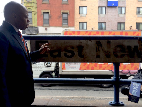 BP Adams Stands Nect To A Faded ENY LIRR Station Sign