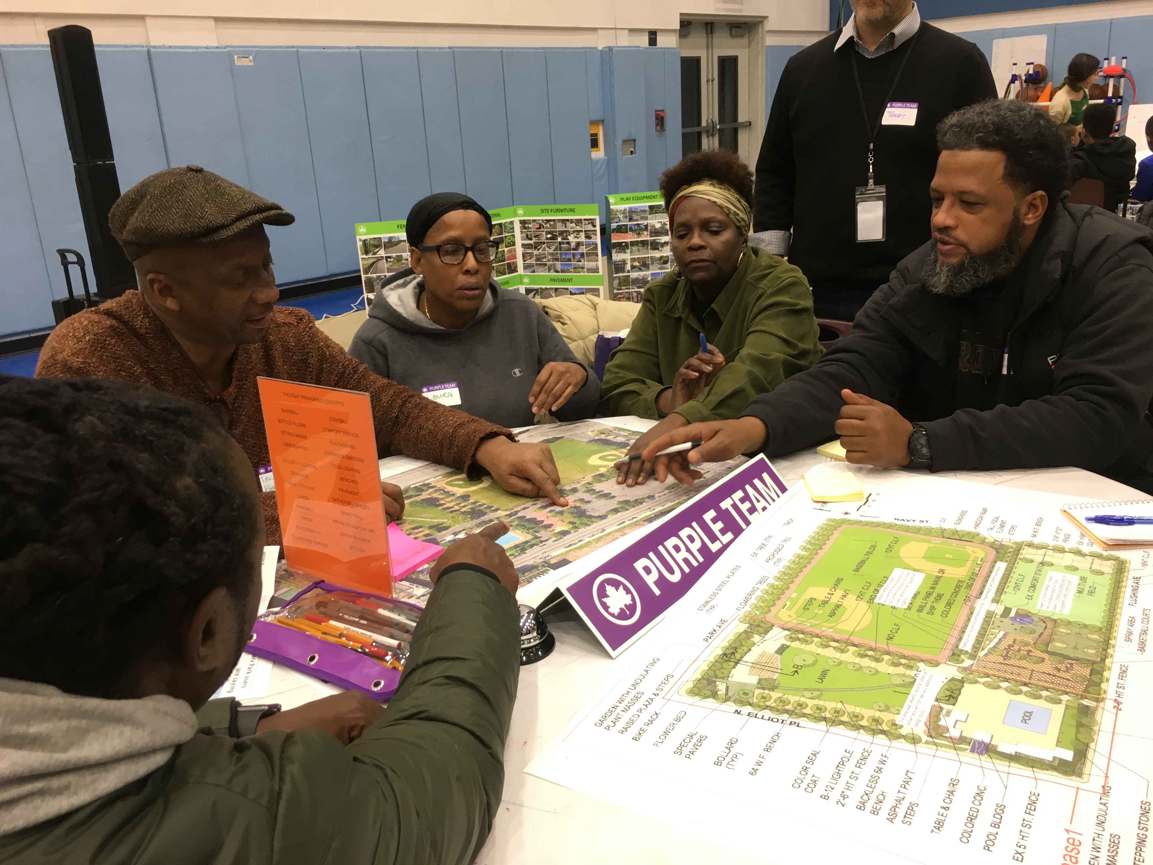 Locals and residents from the Ingersoll Houses discussing the Commodore Barry Park Renovation project. Photo by Israel Rodriguez.