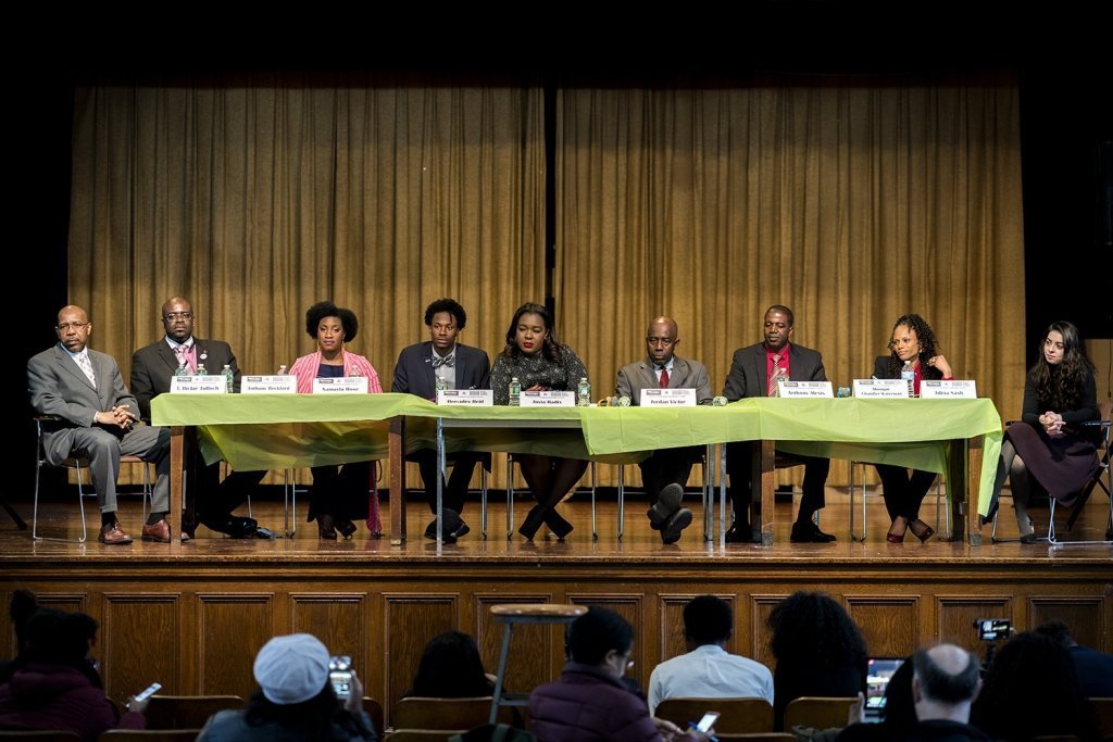 Nine candidates of the 45th City Council District race answered questions from their local students. From left - Rickie Tulloch, Anthony Beckford, Xamayla Rose, Hercules Reid, Jovia Radix, Jordan Victor, Anthony Alexis, Monique Chandler-Waterman, and Adina Sash. (Photo by Tsubasa Berg)