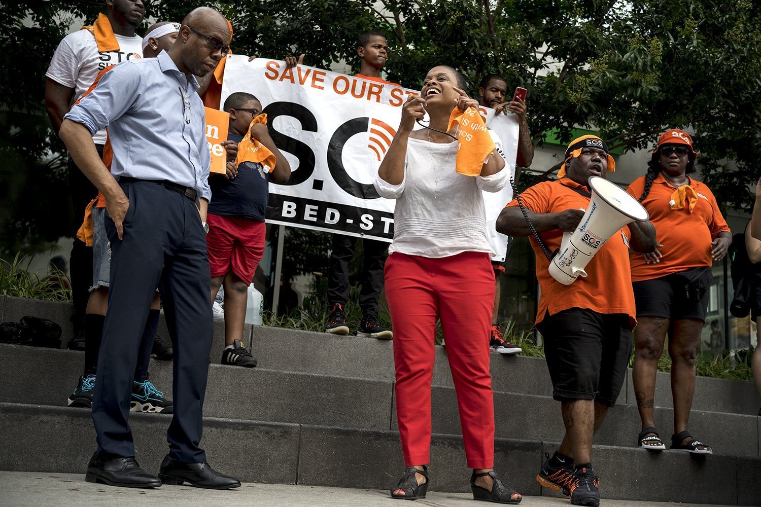 Assemblywoman Tremaine Wright (center) and VIDA President and District Manager of Brooklyn Community Board Henry L. Butler (left) joined the rally on Saturday. (Photo by Tsubasa Berg)