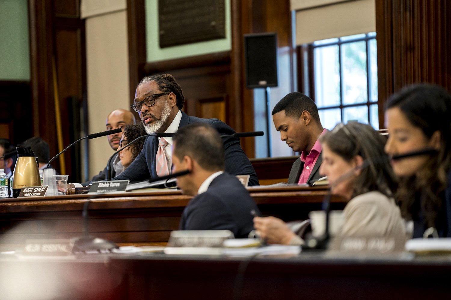 City Council member Robert Cornegy (center left), Jr. and Ritchie Torres (center right) lead the hearing. (Photo by Tsubasa Berg)