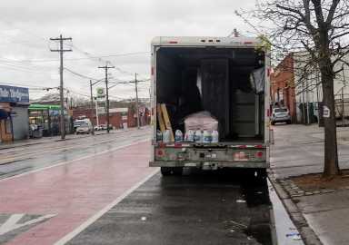 IMG_CoffinandcleaningsuppliesinUhaulparkedonthestreet