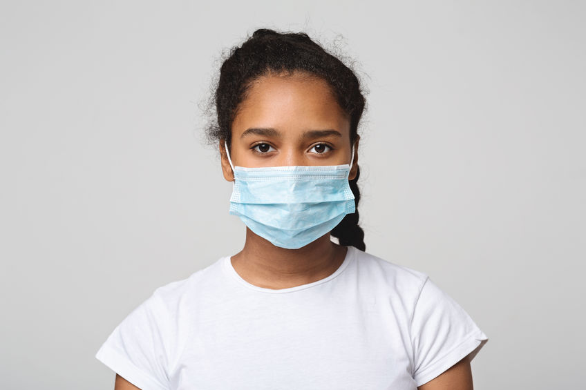 Teen black girl with protective face mask