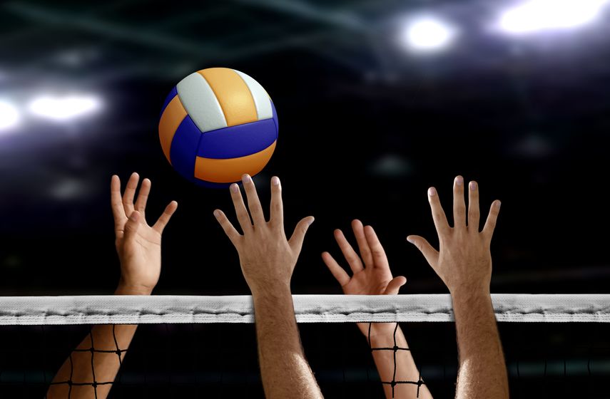 76867779 – volleyball spike hand block over the net