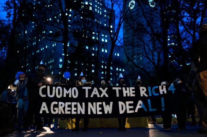 Protesters holding a banner that reads "Cuomo Tax The Rich 4 A Green New Deal!" in Madison Square Park (Photo credit: Tsubasa Berg)