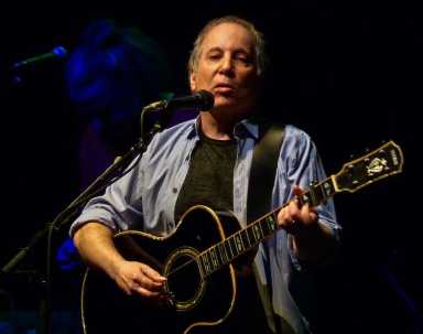 1280px-Paul_Simon_at_the_9-30_Club_(b)