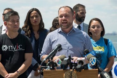 Corey Johnson stands up for immigrant rights (Photo by Jeff Reed)