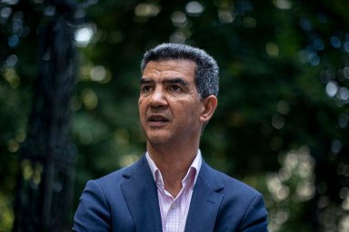 Ctiy Councilman Ydanis Rodriguez in suit, outside in a park