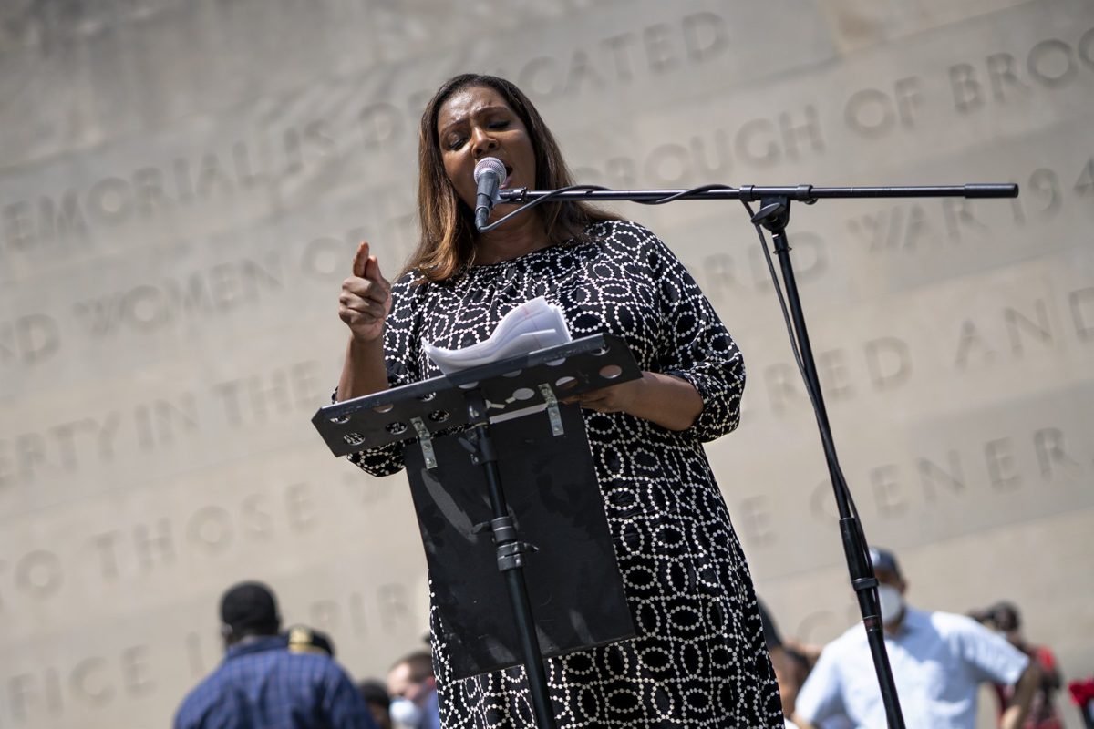 Attorney General Letitia James passionately speaking to the microphone