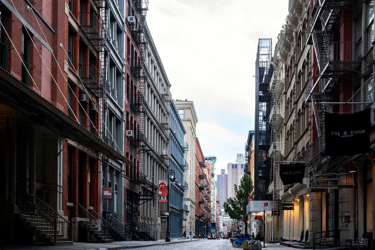 A street view of Prince street. Old Cast Iron buildings occupied by boutique design stores.