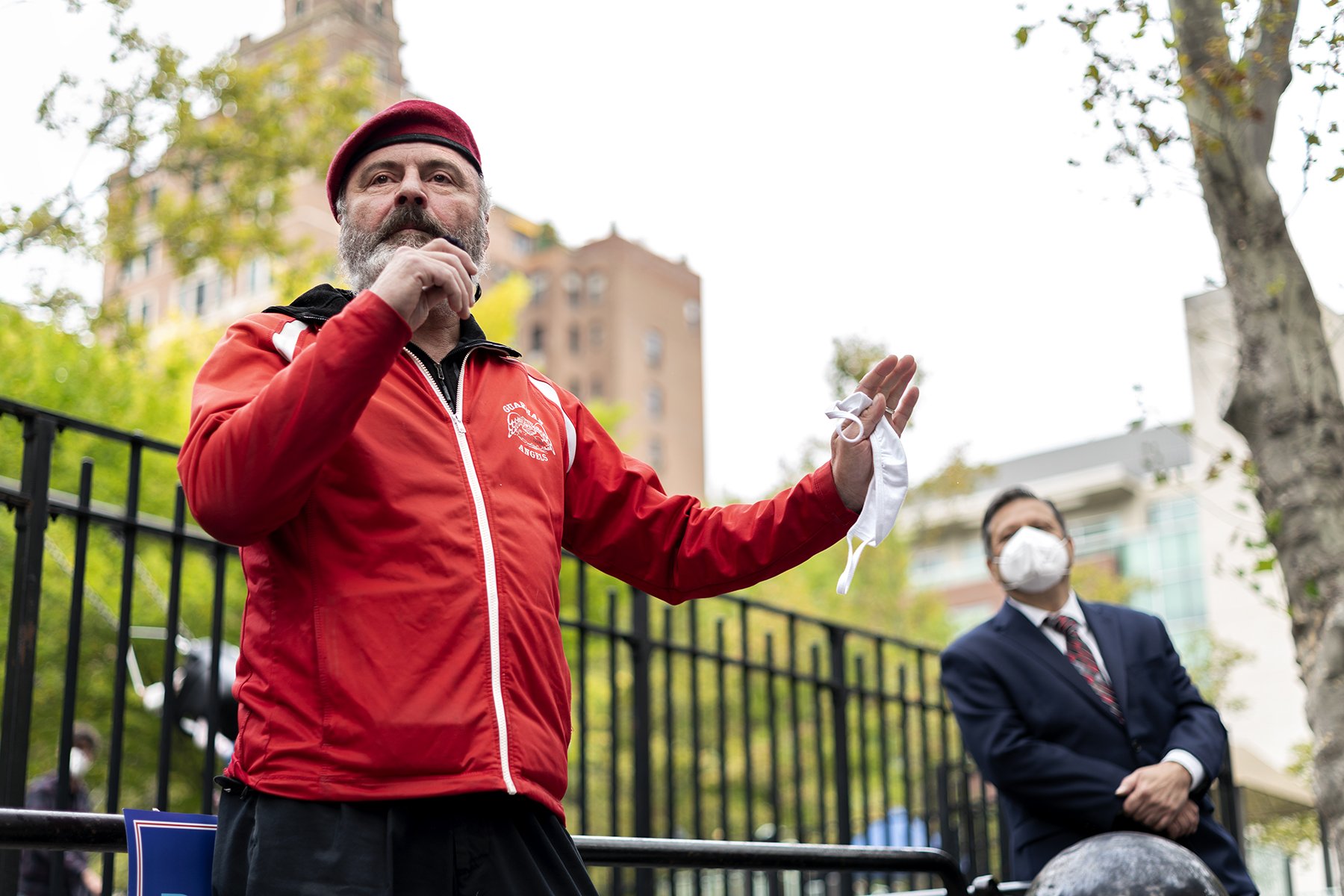 Guardian Angels Founder and talk radio host Curtis Sliwa speaking on the microphone without his mask next to Lou Puliafito (Photo credit: Tsubasa Berg))