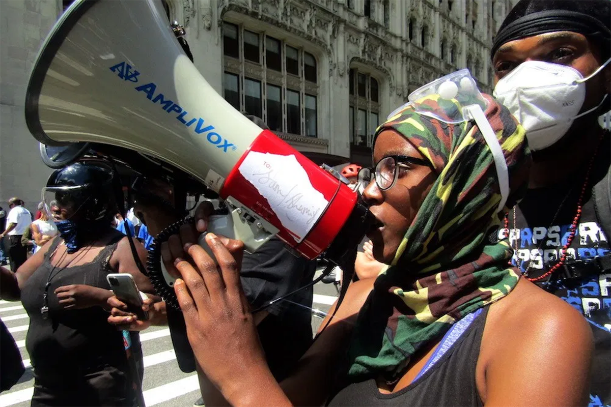 An Occupy City Hall protester on the bullhorn. Photo by Ariama C. Long