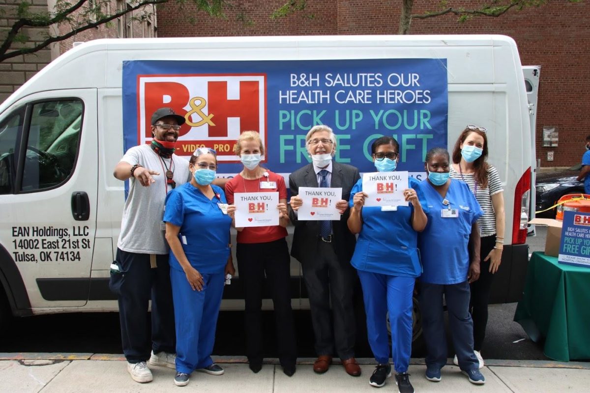 Volunteer Mark Appel proudly stands alongside Lenox Hill Hospital staff, thanking B&H for their gifts [photo contributed to NYCP]