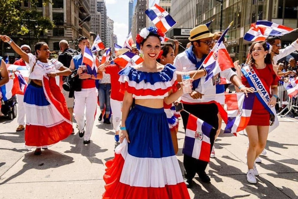 Dominican-Americans take to the streets, sporting the Dominican colors of red, white and blue (Photo by Louric Rankine)