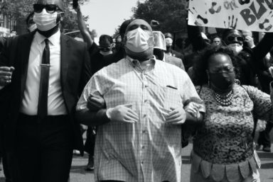 Corey Ortega (center) marches with BLM protesters [photo by Christopher Tomas Smith]