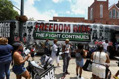 2021-06-22T110425Z_1_LYNXNPEH5L0I9_RTROPTP_4_USA-RACE-BUS-1200×800-1