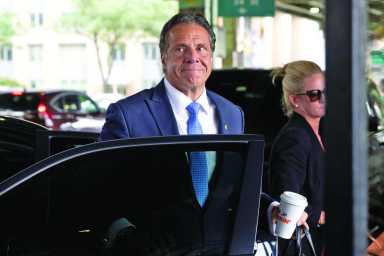New York Governor Andrew Cuomo arrives to depart in his helicopter after announcing his resignation in Manhattan, New York City