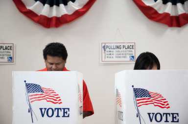 Voters voting in polling place