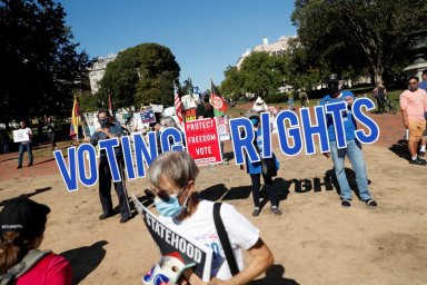 FILE PHOTO: Activists gather during a demonstration for voting rights at the White House in Washington